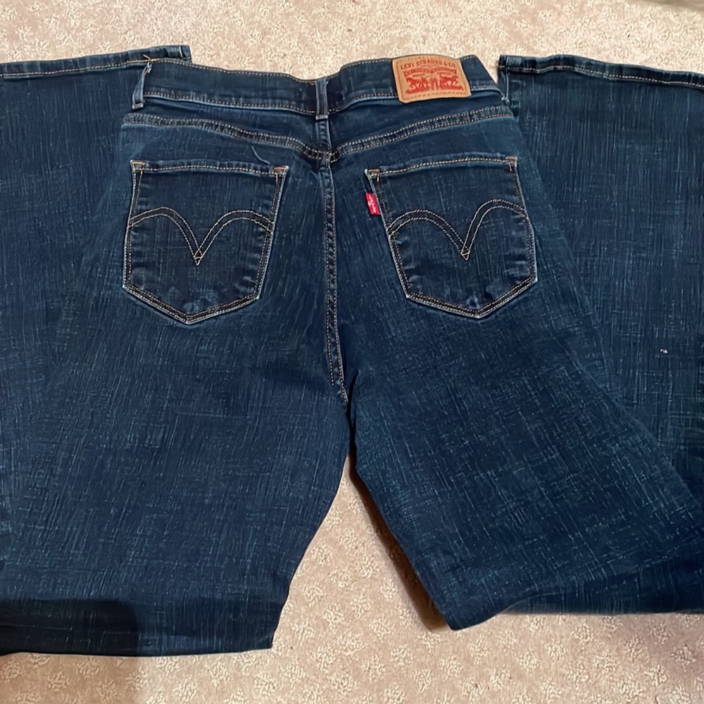 Levi’s, size 4M, size 27/32, boot cut, blue jeans.